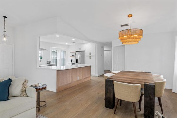 Chandelier, Dining room, Interior, Kitchen, Pendant Lights, Recessed Lighting, Stainless Steel Appliances, Wood Texture Flooring
