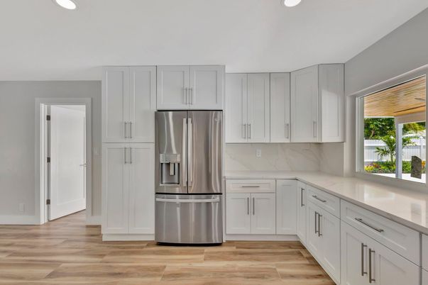 Interior, Kitchen, Marble Walls, Recessed Lighting, Stainless Steel Appliances, Wood Texture Flooring