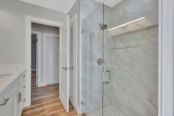 Bathroom, Glass Shower, Interior, Marble Walls, Wood Texture Flooring