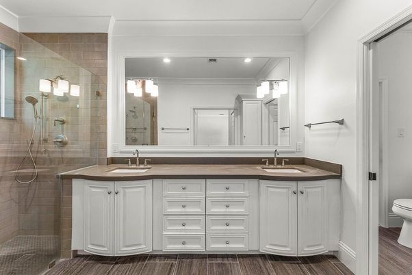 Bathroom, Dual Sink Vanities, Glass Shower, Interior, Recessed Lighting, Wood Texture Flooring
