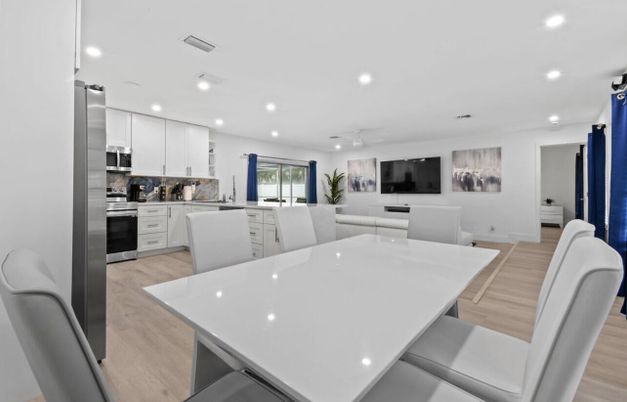 Dining room, Interior, Kitchen, Living room, Recessed Lighting, Stainless Steel Appliances, Wood Texture Flooring