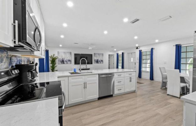 Dining room, Interior, Kitchen, Recessed Lighting, Stainless Steel Appliances, Wood Texture Flooring