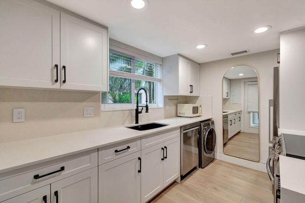 Interior, Kitchen, Recessed Lighting, Washer, Wood Texture Flooring