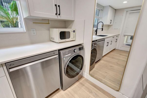 Interior, Recessed Lighting, Stainless Steel Appliances, Washer, Wood Texture Flooring