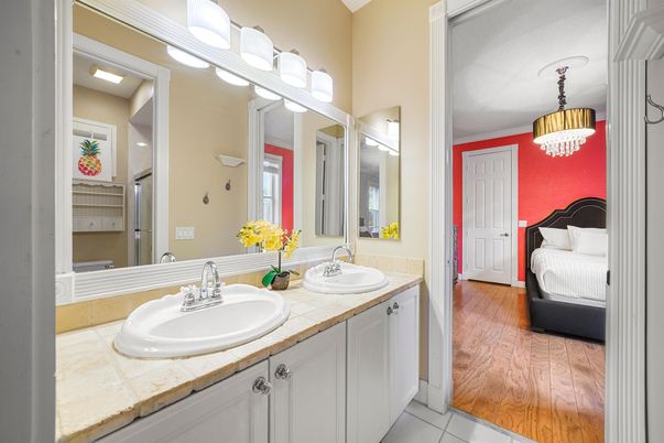 Bathroom, Bedroom, Chandelier, Dual Sink Vanities, Interior, Pendant Lights, Tile Countertops, Wood Texture Flooring