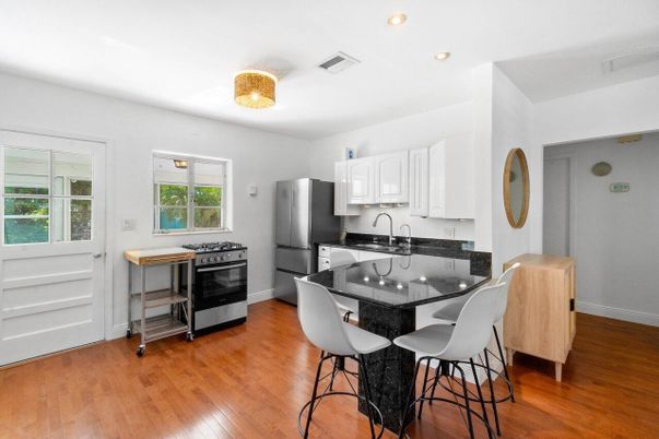Dining room, Interior, Kitchen, Recessed Lighting, Stainless Steel Appliances, Wood Texture Flooring