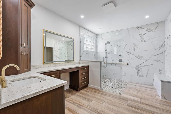 Bathroom, Dual Sink Vanities, Glass Shower, Interior, Marble Walls, Recessed Lighting, Wood Texture Flooring