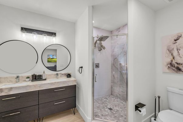 Bathroom, Dual Sink Vanities, Glass Shower, Interior, Recessed Lighting, Wood Texture Flooring