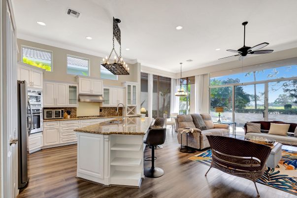 Chandelier, Interior, Kitchen, Living room, Pendant Lights, Recessed Lighting, Stainless Steel Appliances, Water, Wood Texture Flooring