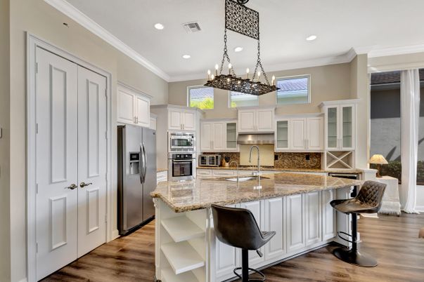 Chandelier, Interior, Kitchen, Pendant Lights, Recessed Lighting, Stainless Steel Appliances, Wood Texture Flooring
