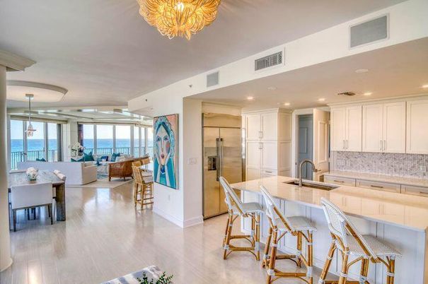 Chandelier, Dining room, Interior, Kitchen, Living room, Recessed Lighting, Stainless Steel Appliances, Water, Wood Texture Flooring