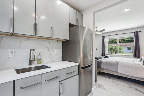 Bedroom, Interior, Kitchen, Marble, Marble Walls, Recessed Lighting, Stainless Steel Appliances