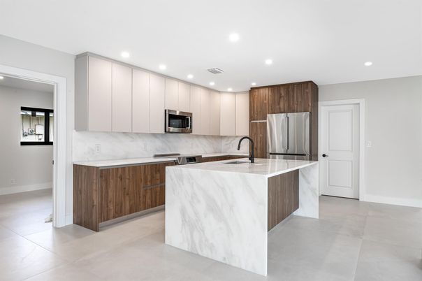 Interior, Kitchen, Marble Walls, Recessed Lighting, Stainless Steel Appliances