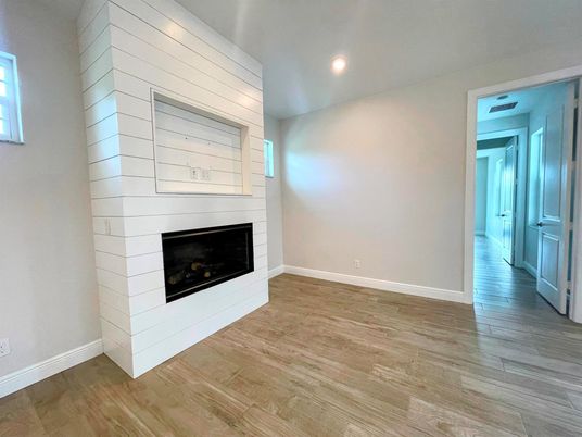 Empty room, Fireplace, Interior, Recessed Lighting, Wood Texture Flooring