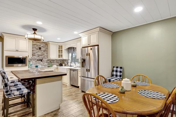 Dining room, Interior, Kitchen, Pendant Lights, Recessed Lighting, Stainless Steel Appliances, Stone Walls, Wood Texture Flooring