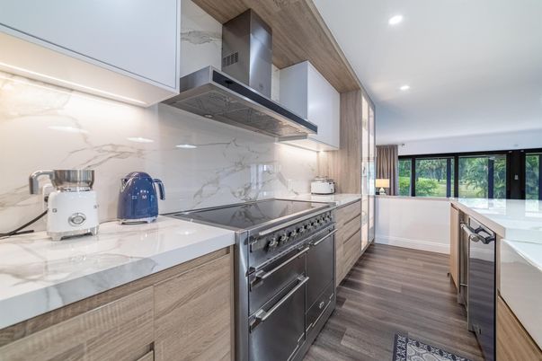 Interior, Kitchen, Marble Walls, Recessed Lighting, Stainless Steel Appliances, Wood Texture Flooring
