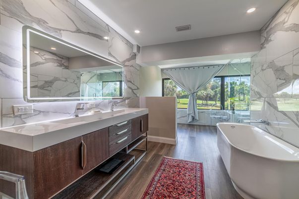 Bathroom, Dual Sink Vanities, Free Standing Baths, Interior, Marble Walls, Recessed Lighting, Wood Texture Flooring