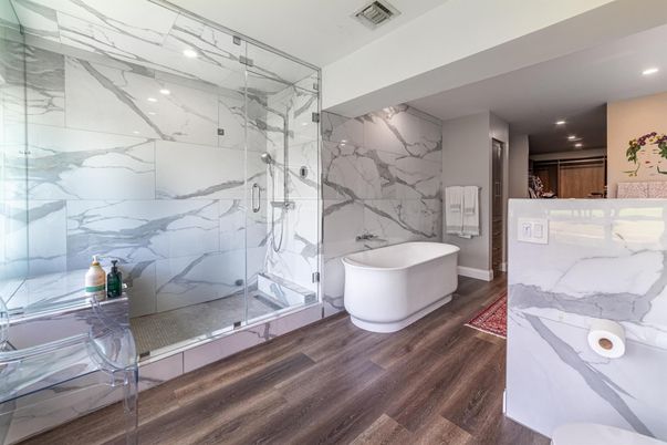Bathroom, Free Standing Baths, Glass Shower, Interior, Marble Walls, Recessed Lighting, Wood Texture Flooring