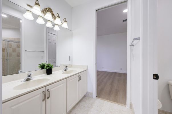 Bathroom, Dual Sink Vanities, Glass Shower, Interior, Recessed Lighting, Wood Texture Flooring