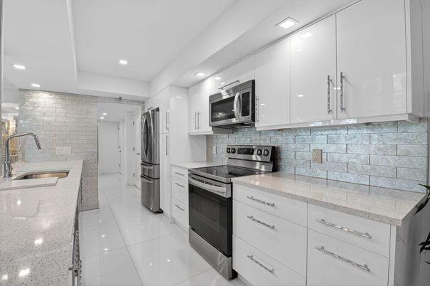 Interior, Kitchen, Recessed Lighting, Stainless Steel Appliances, Stone Walls