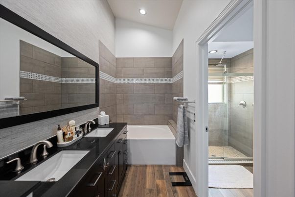 Bathroom, Dual Sink Vanities, Glass Shower, Interior, Recessed Lighting, Wood Texture Flooring