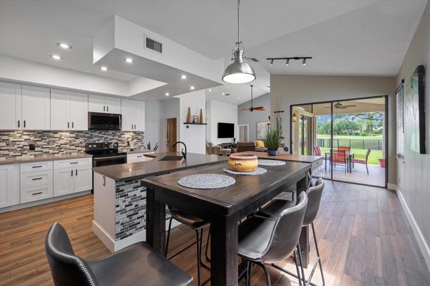 Dining room, Interior, Kitchen, Pendant Lights, Recessed Lighting, Stainless Steel Appliances, Wood Texture Flooring