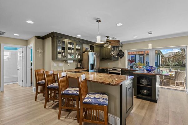 Dining room, Interior, Kitchen, Pendant Lights, Recessed Lighting, Stainless Steel Appliances, Wood Texture Flooring