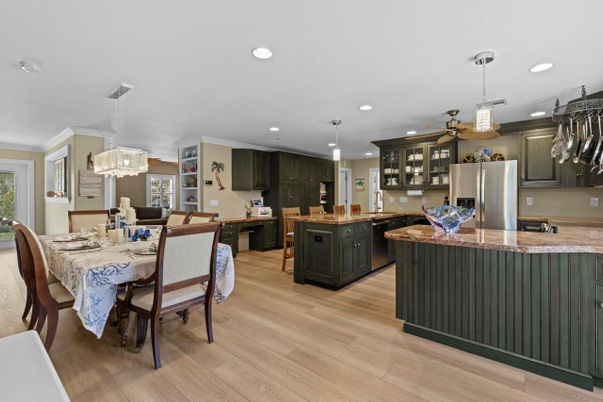 Chandelier, Dining room, Interior, Kitchen, Pendant Lights, Recessed Lighting, Stainless Steel Appliances, Wood Texture Flooring
