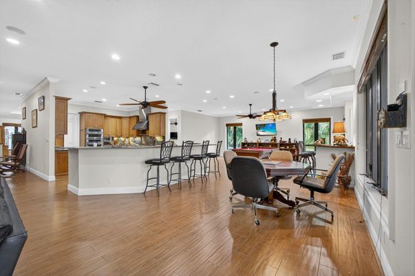 Dining room, Interior, Kitchen, Pendant Lights, Recessed Lighting, Stainless Steel Appliances, Wood Texture Flooring