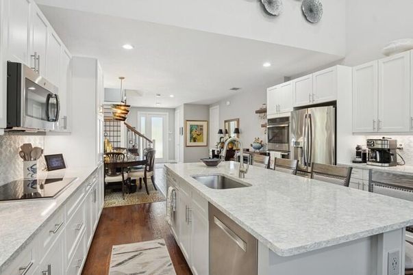 Dining room, Interior, Kitchen, Pendant Lights, Recessed Lighting, Stainless Steel Appliances, Wood Texture Flooring