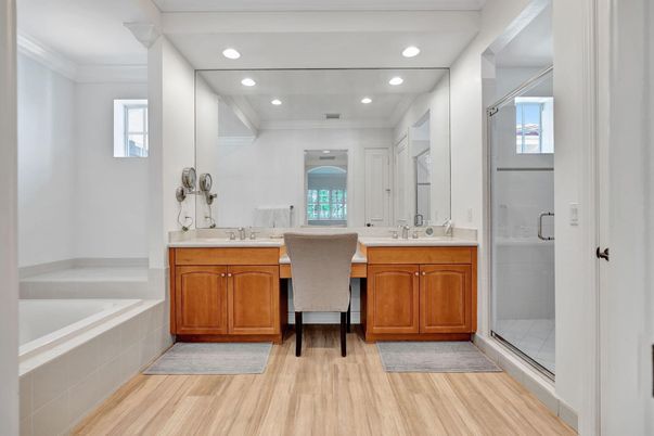 Bathroom, Dual Sink Vanities, Glass Shower, Interior, Recessed Lighting, Wood Texture Flooring