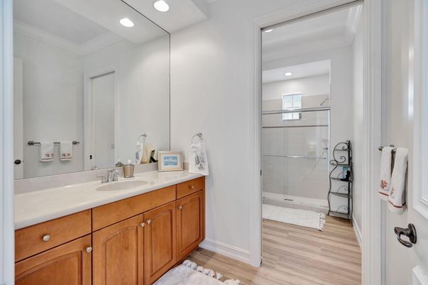 Bathroom, Dual Sink Vanities, Glass Shower, Interior, Recessed Lighting, Wood Texture Flooring