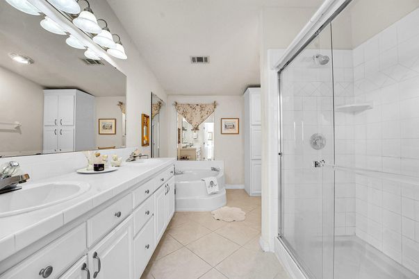 Bathroom, Dual Sink Vanities, Glass Shower, Interior, Recessed Lighting, Tile Countertops