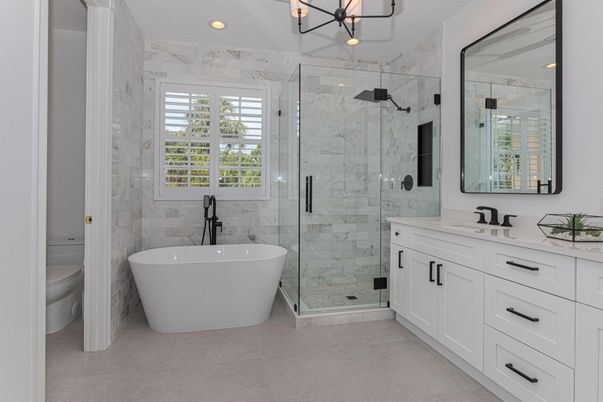 Bathroom, Dual Sink Vanities, Free Standing Baths, Glass Shower, Interior, Marble Walls, Pendant Lights, Recessed Lighting
