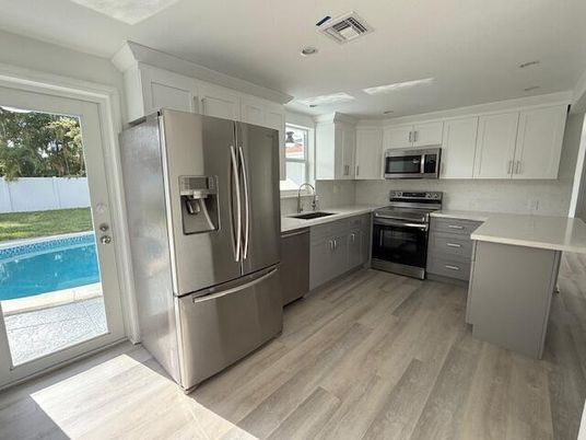 Interior, Kitchen, Recessed Lighting, Stainless Steel Appliances, Wood Texture Flooring