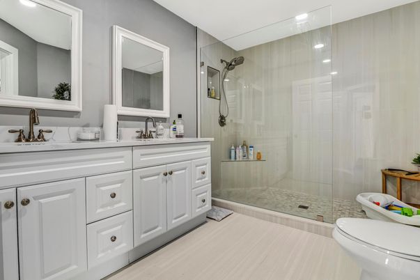 Bathroom, Dual Sink Vanities, Glass Shower, Interior, Recessed Lighting, Wood Texture Flooring