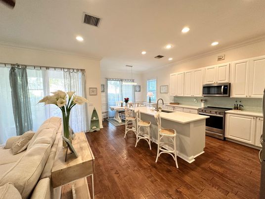 Chandelier, Dining room, Interior, Kitchen, Living room, Pendant Lights, Recessed Lighting, Stainless Steel Appliances, Wood Texture Flooring