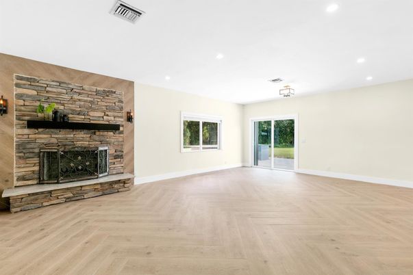 Empty room, Fireplace, Interior, Recessed Lighting, Stone Walls, Wood Texture Flooring