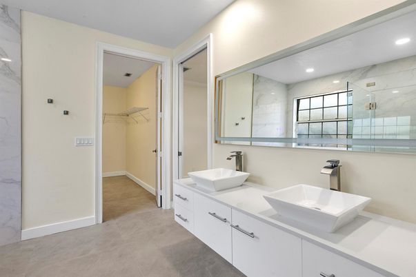 Bathroom, Dual Sink Vanities, Interior, Marble Walls, Recessed Lighting