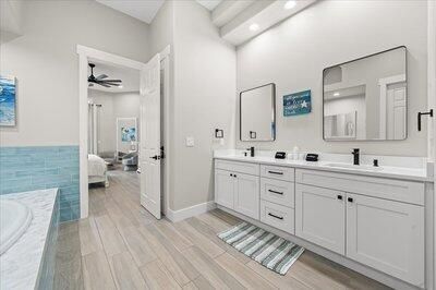 Bathroom, Dual Sink Vanities, Interior, Recessed Lighting, Wood Texture Flooring
