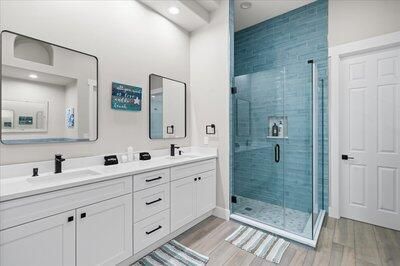 Bathroom, Dual Sink Vanities, Glass Shower, Interior, Recessed Lighting, Wood Texture Flooring