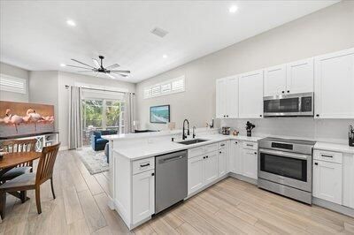 Dining room, Interior, Kitchen, Recessed Lighting, Stainless Steel Appliances, Wood Texture Flooring