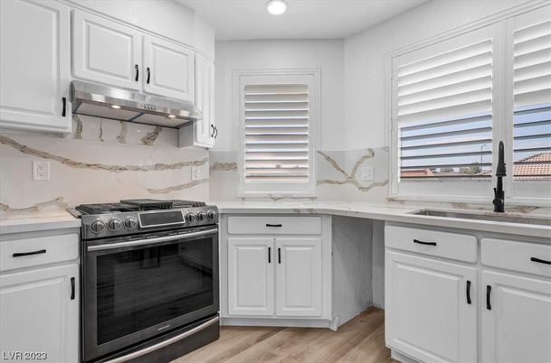 Interior, Kitchen, Marble Walls, Recessed Lighting, Stainless Steel Appliances, Wood Texture Flooring