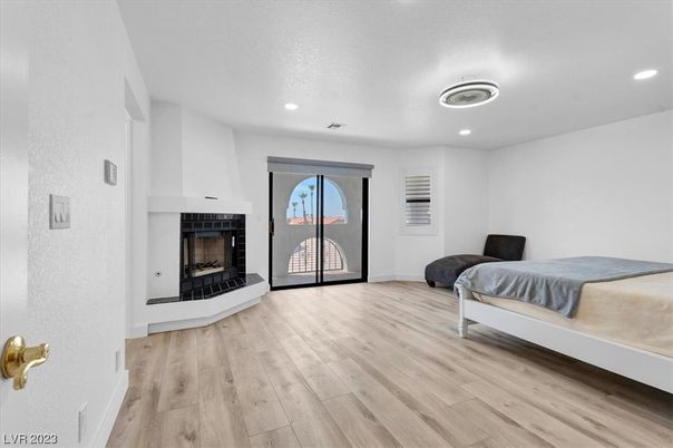 Bedroom, Fireplace, Interior, Recessed Lighting, Wood Texture Flooring