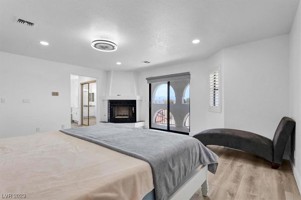Bedroom, Fireplace, Interior, Recessed Lighting, Wood Texture Flooring