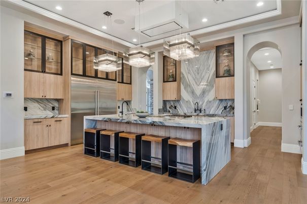 Interior, Kitchen, Marble Walls, Pendant Lights, Recessed Lighting, Stainless Steel Appliances, Wood Texture Flooring