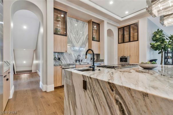 Chandelier, Interior, Kitchen, Marble Walls, Recessed Lighting, Stainless Steel Appliances, Wood Texture Flooring