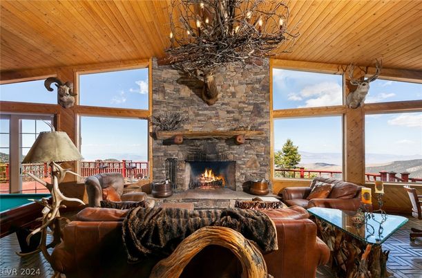 Chandelier, Fireplace, Interior, Living room, Stone Walls, Wooden Ceilings