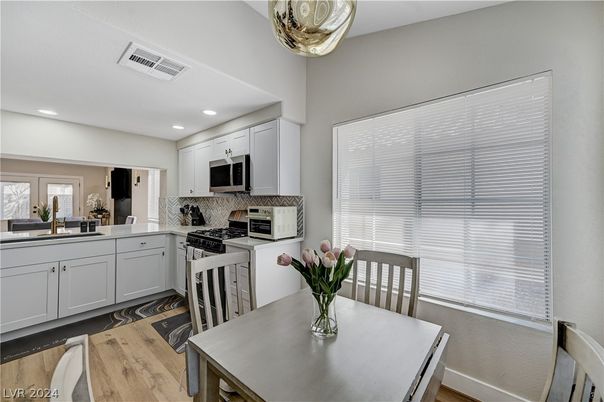 Dining room, Interior, Kitchen, Recessed Lighting, Stainless Steel Appliances, Wood Texture Flooring