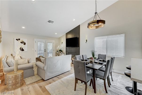 Dining room, Fireplace, Interior, Living room, Pendant Lights, Recessed Lighting, Wood Texture Flooring